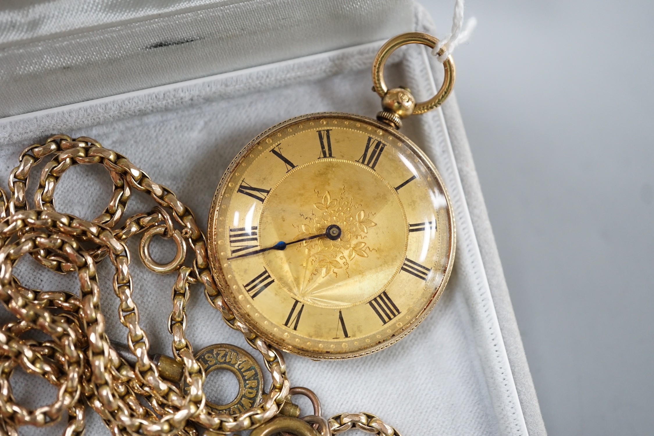 An 18k engraved gold open faced keywind pocket watch, gross 40 grams and a 9ct chain, 20.4 grams.